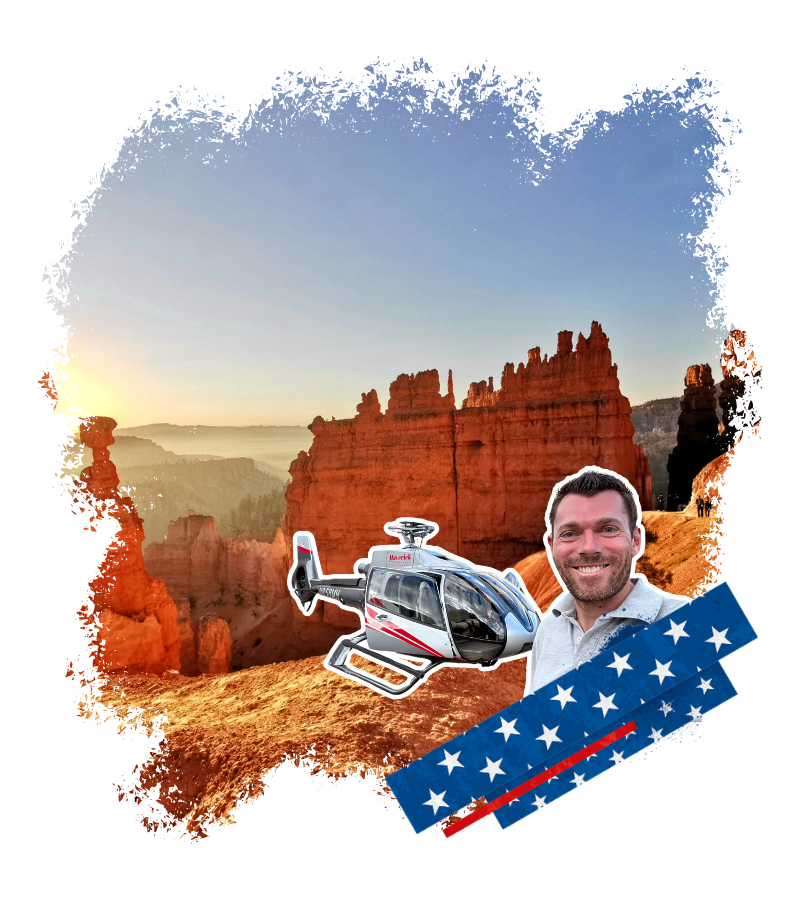 Im warmen Morgenlicht ragen rote Felsformationen über einer weiten Canyonlandschaft auf, während ein Helikopter, ein lächelnder Reiseexperte und ein USA-Bandmotiv zu sehen sind.