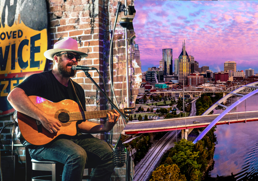 Ein Gitarrist mit Akustikgitarre spielt vor einer Stadt am Fluss – musikalische Eindrücke der Deep-South-Rundreise.